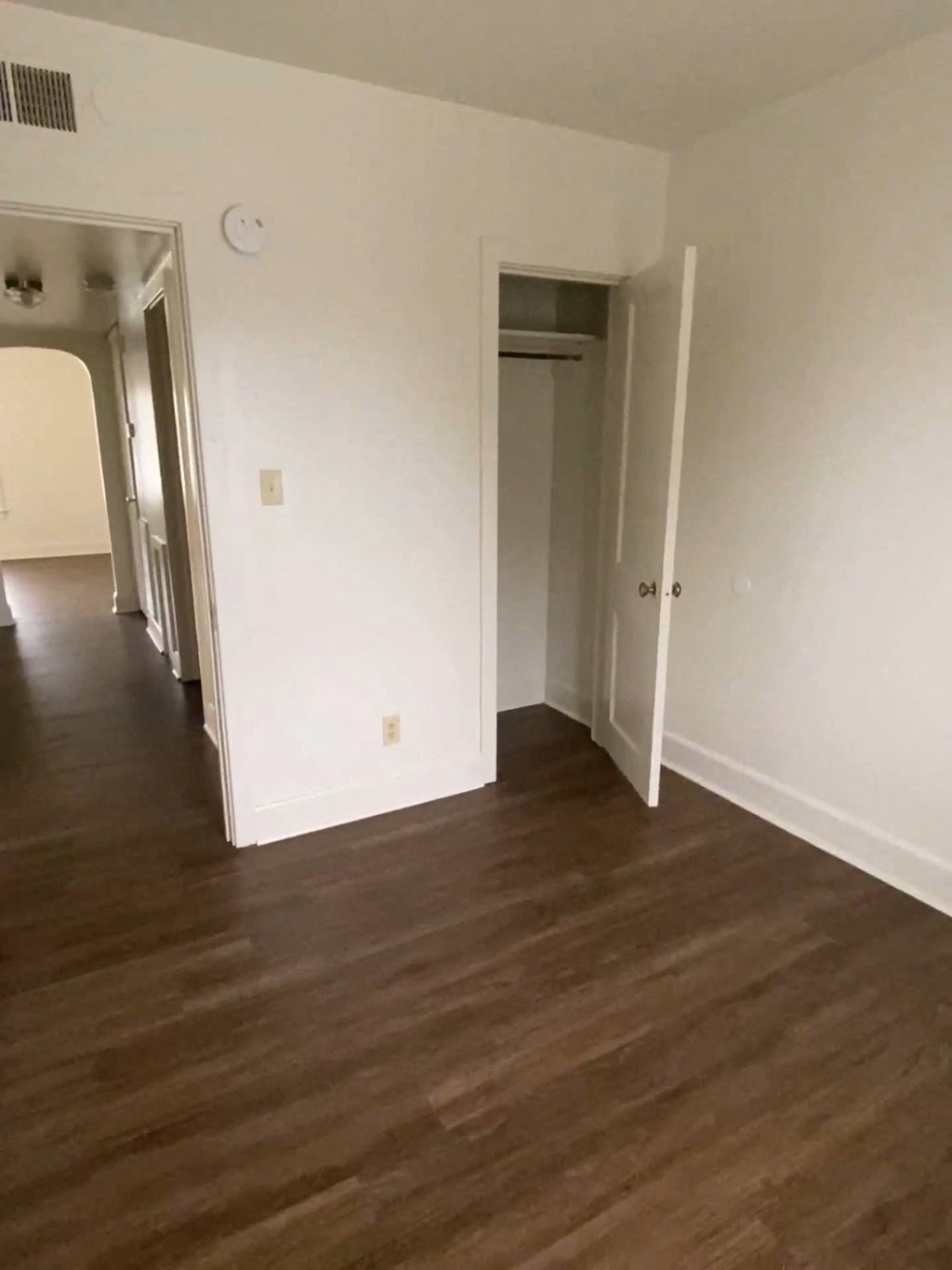 Mitten Apartments - Bedroom / Closet / Hallway to Living room / Wood-grain, vinyl plank flooring