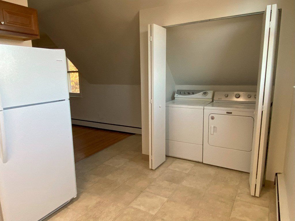 a laundry room with a washer and dryer