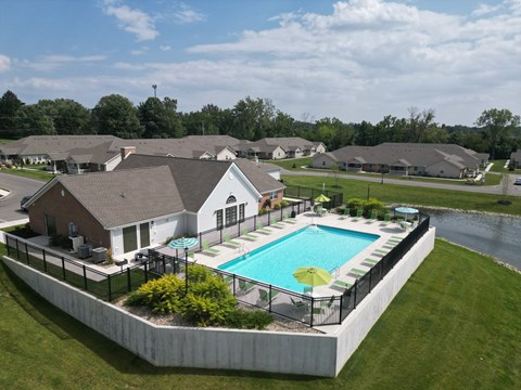 A large house with a pool in the backyard.