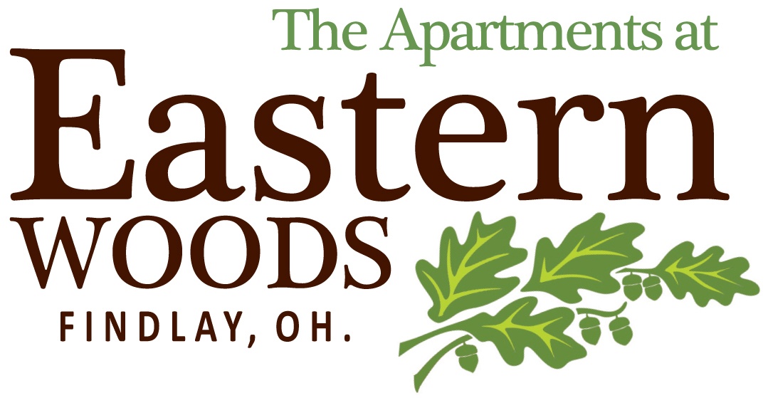 The image is a logo for The Apartments at Eastern Woods in Findlay, OH.