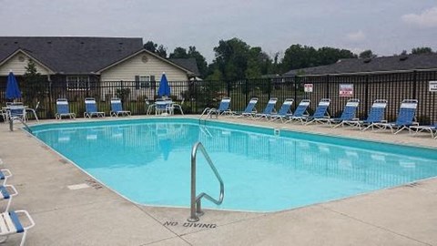 A pool with no diving sign on the ground.