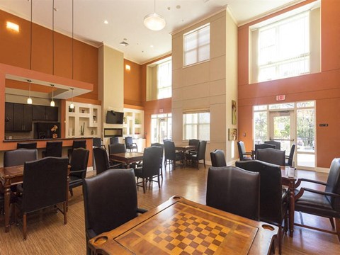 a dining room with tables and chairs and a chess board