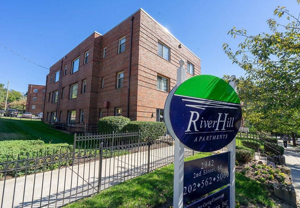 a building with a street sign in front of it