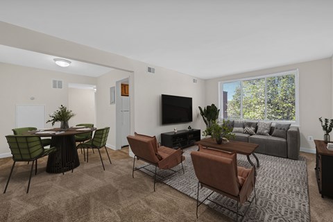 A living room with a brown carpet and furniture.