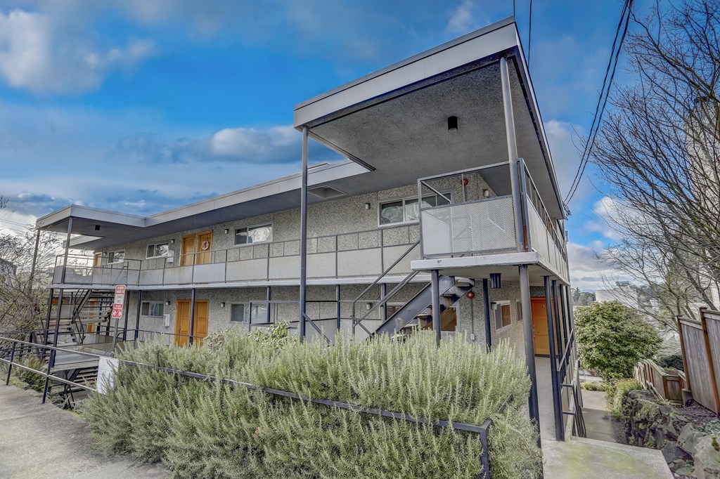 a modern house with a balcony and a staircase