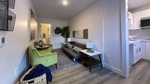 a living room with a couch and a chair and a table