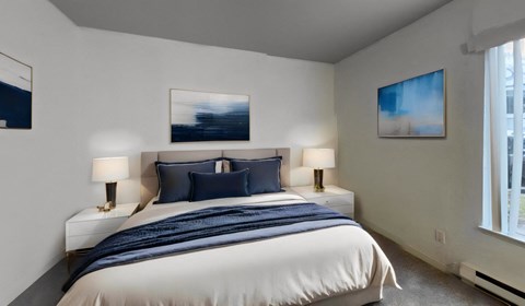 a bedroom with a large bed and a large window