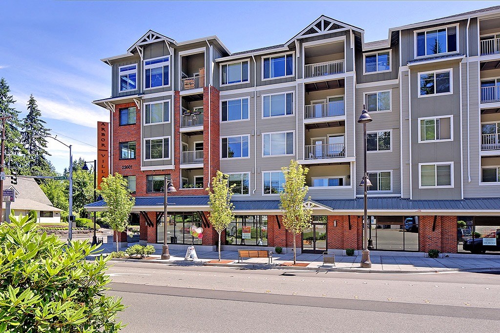 an apartment building on the corner of a street