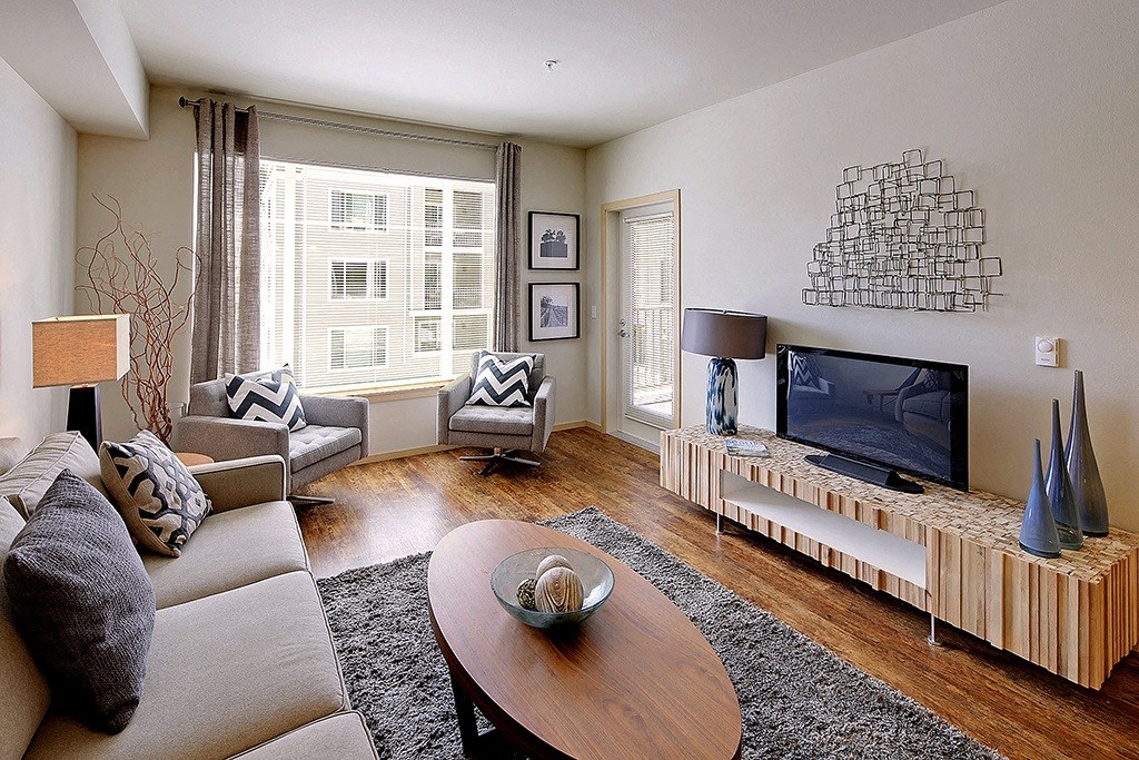 a living room with a couch and a tv