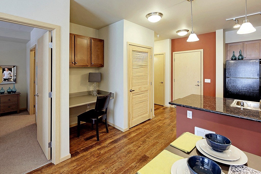 a view of a kitchen and a living room with a dining room table