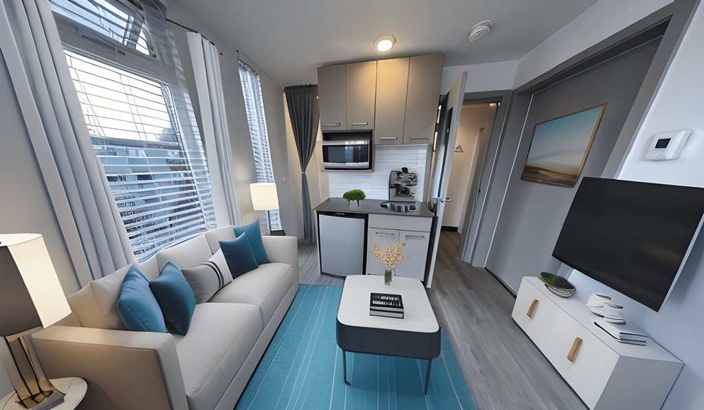 a living room and kitchen in a small apartment