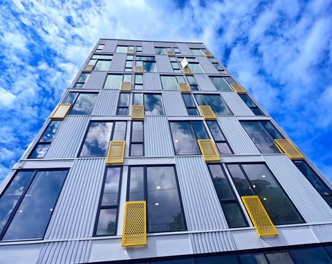 Facade of a tall building with a blue sky at Alt Capitol Hill.