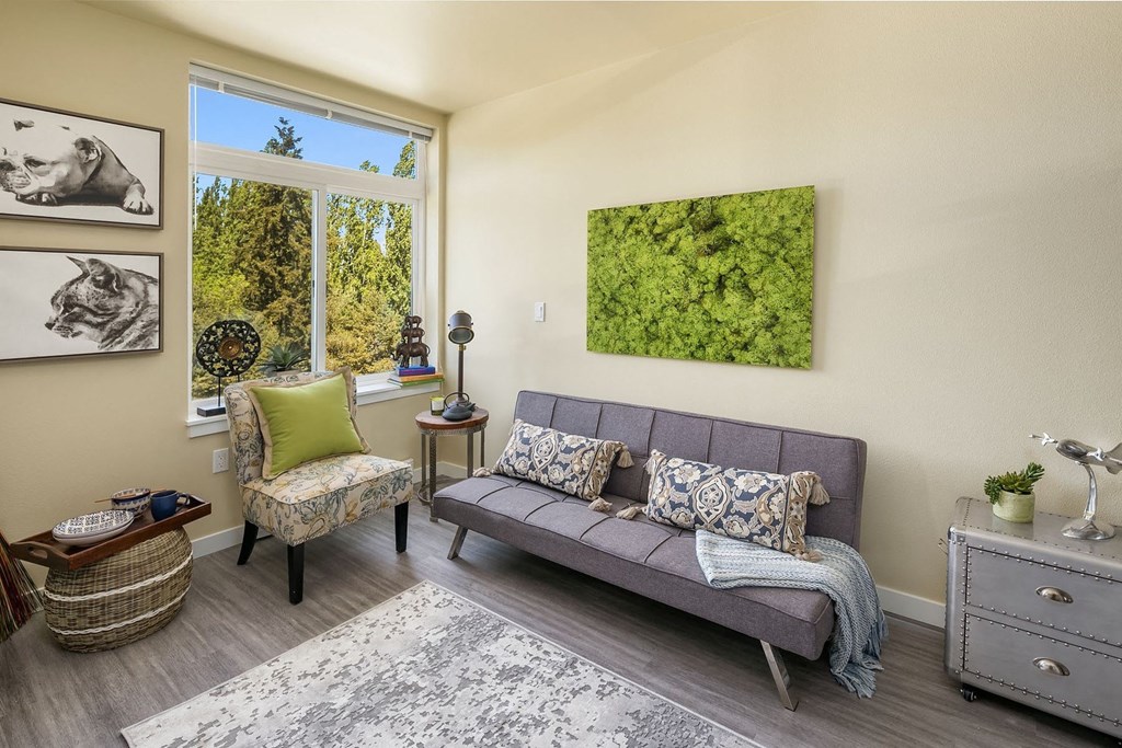 a living room with a couch and a window