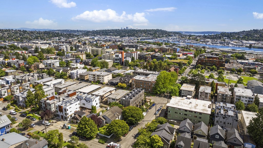 an aerial view of a city with buildings and trees