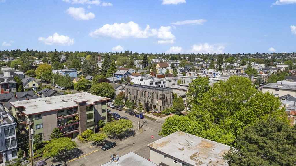 an aerial view of a city with buildings and trees