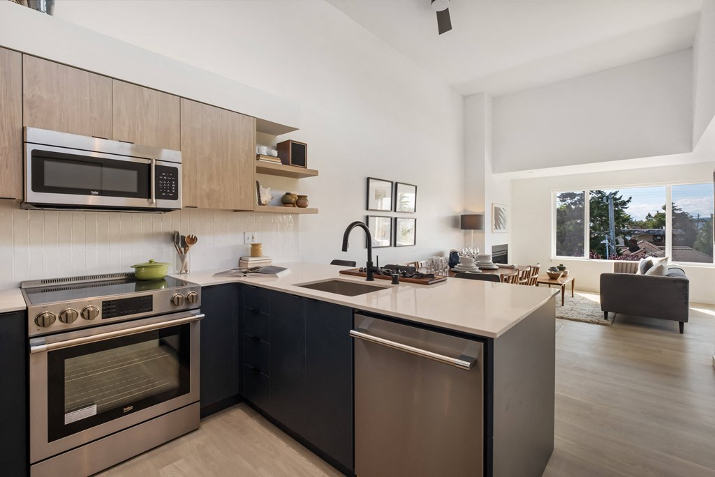 a kitchen and living room in a 555 waverly unit