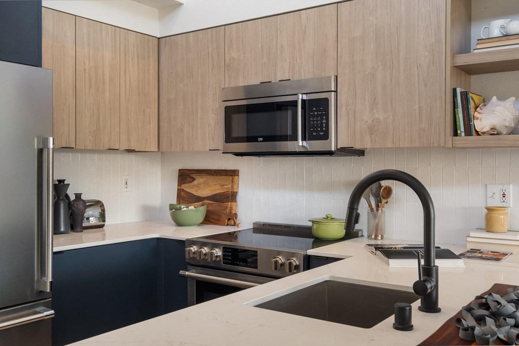 a kitchen with a sink and a stove