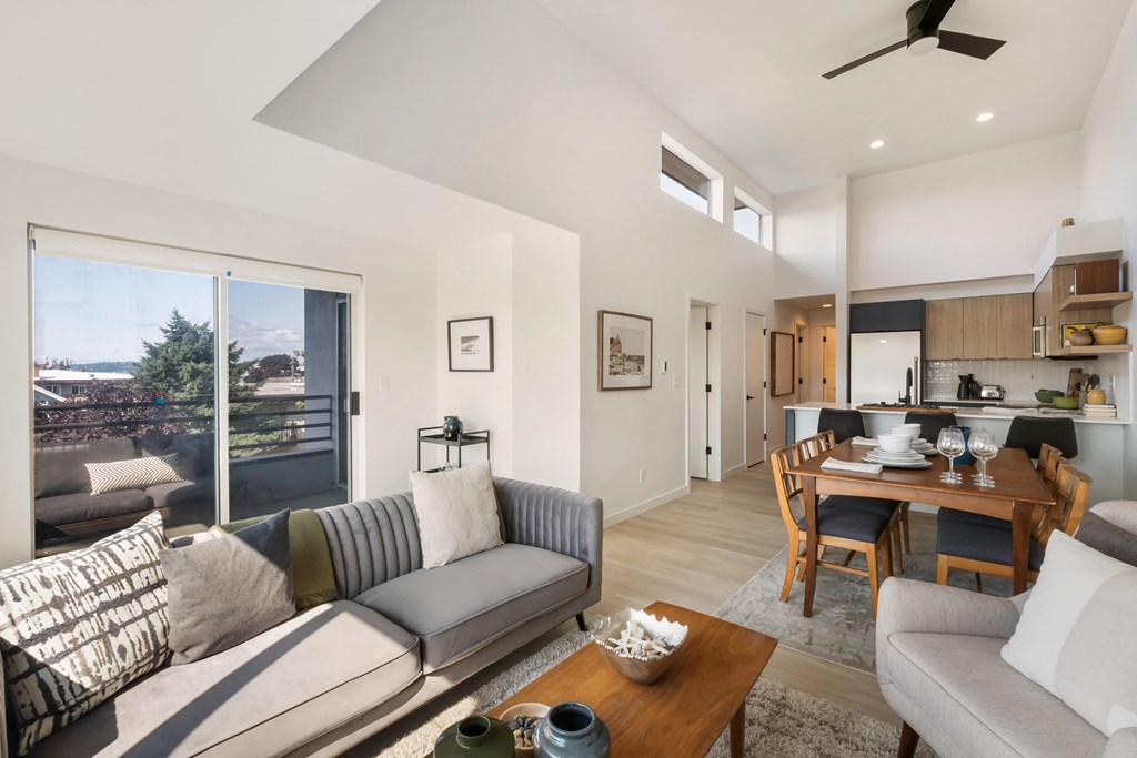 a living room with a couch a table and a chair