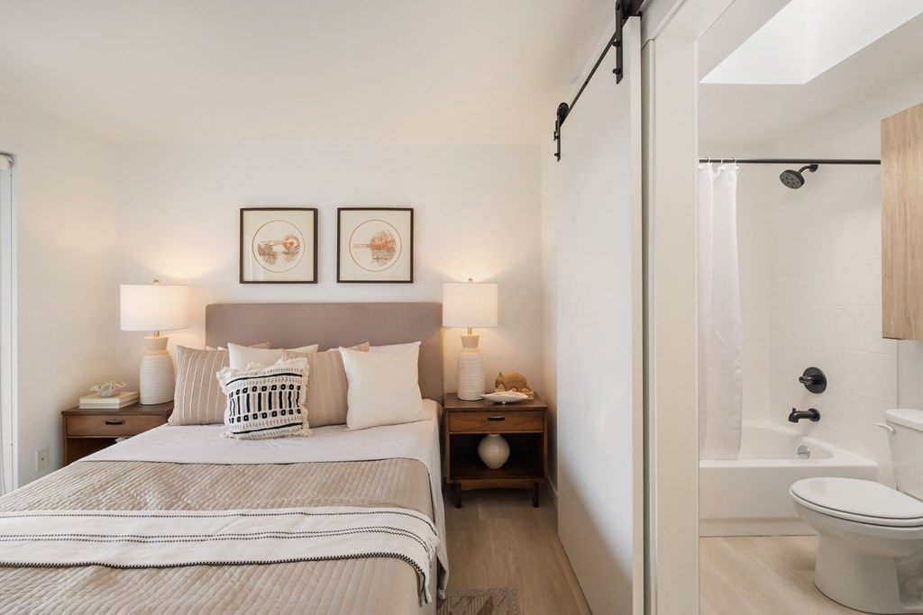 a bedroom with a bed and two night stands