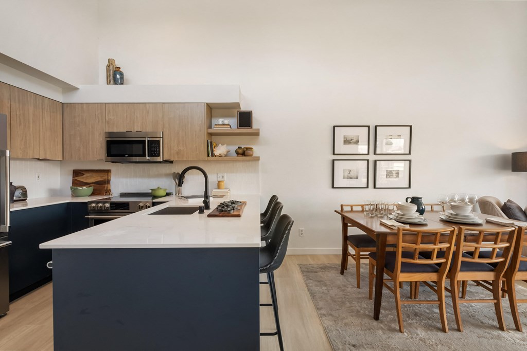 a kitchen and dining area in a 555 waverly unit
