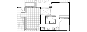 A black and white floor plan of a house with a kitchen, living room, and bathroom.