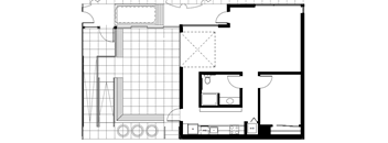 A floor plan of a house with a kitchen, living room, and bathroom.