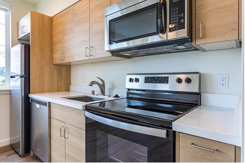 a kitchen with a stove and a microwave