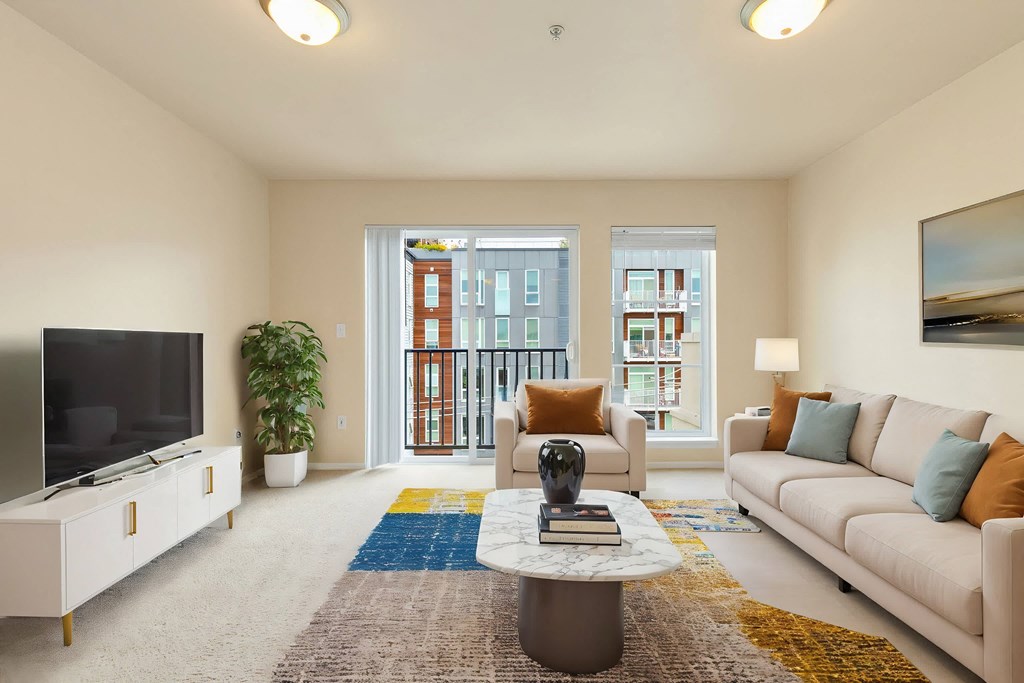 a living room with a couch and a coffee table and a television