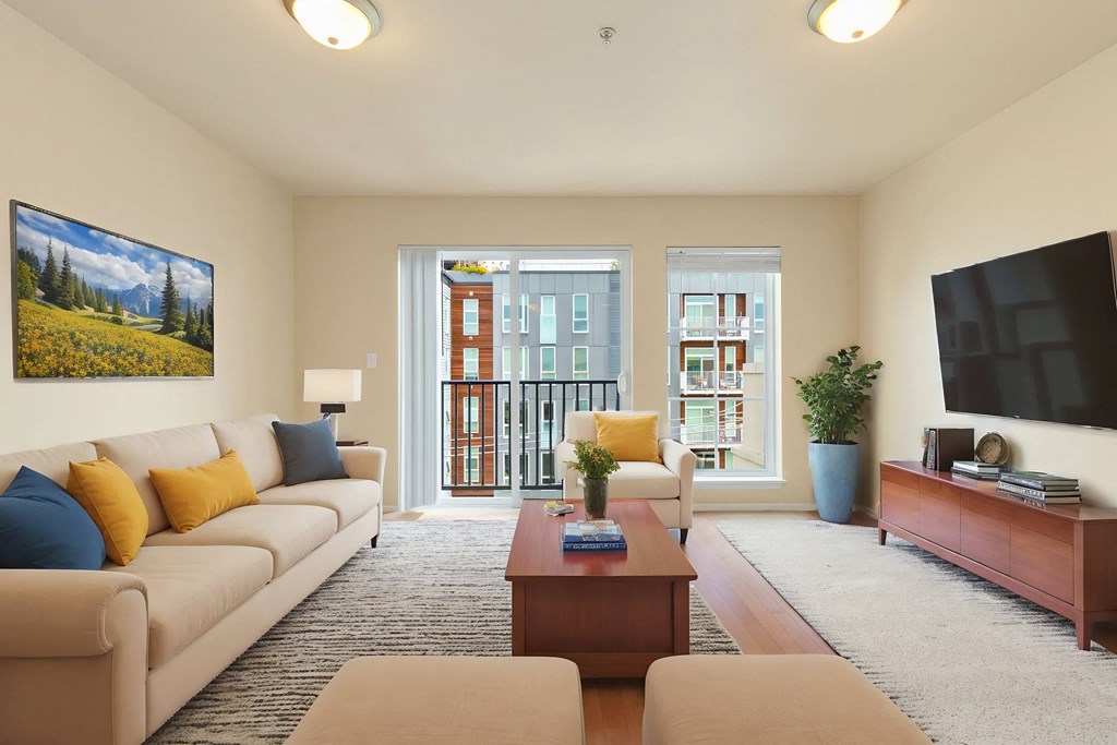 a living room with a couch and a coffee table and a television