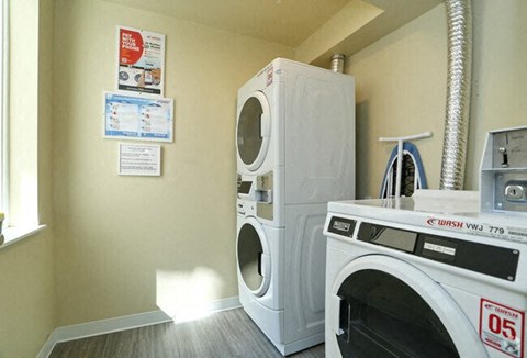 a washing machine and a dryer in a laundry room