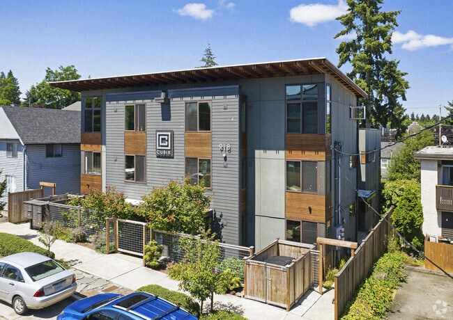 a modern house with a blue and wood facade