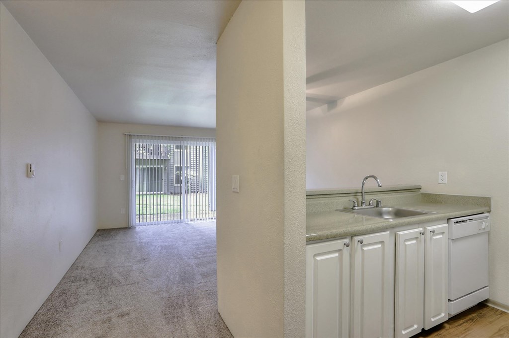 a kitchen and living room in an apartment