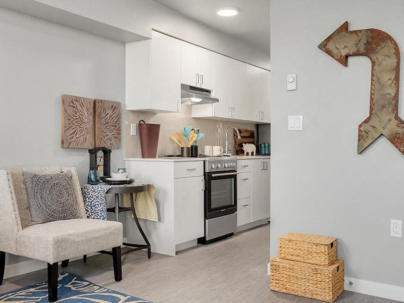 a kitchen with an arrow on the wall