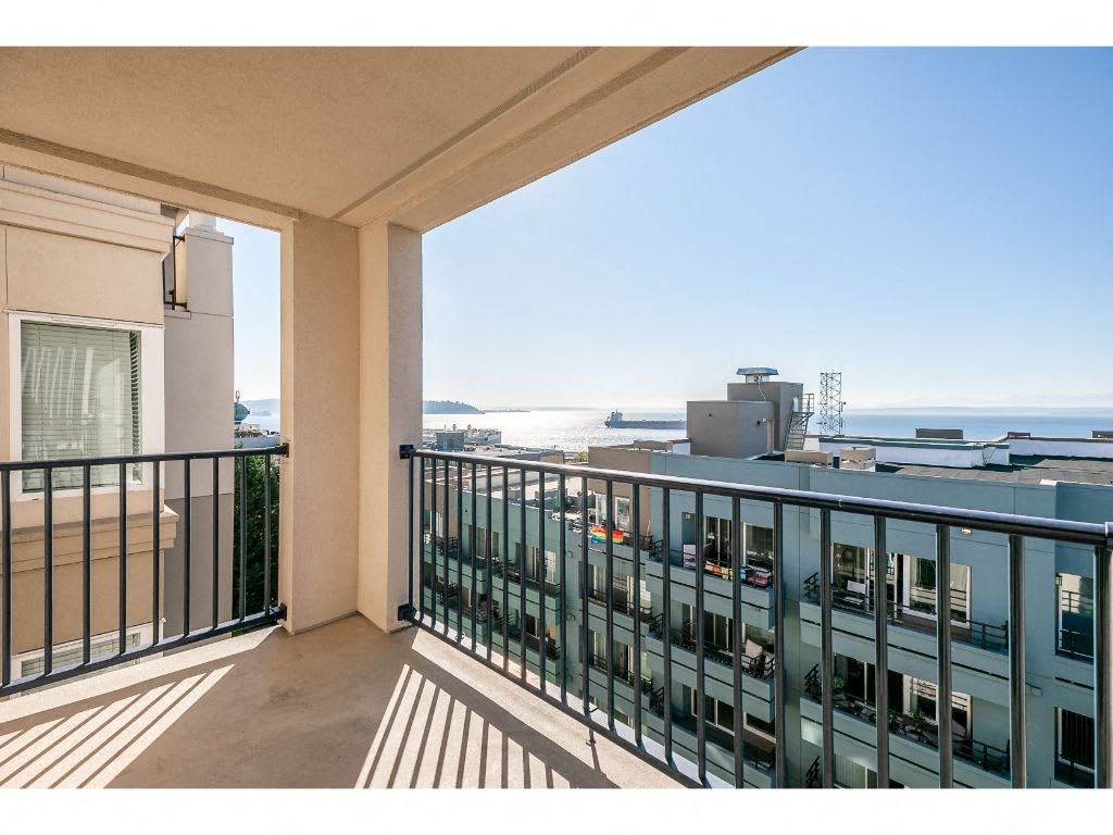 a view of the ocean from a balcony with a balcony railing