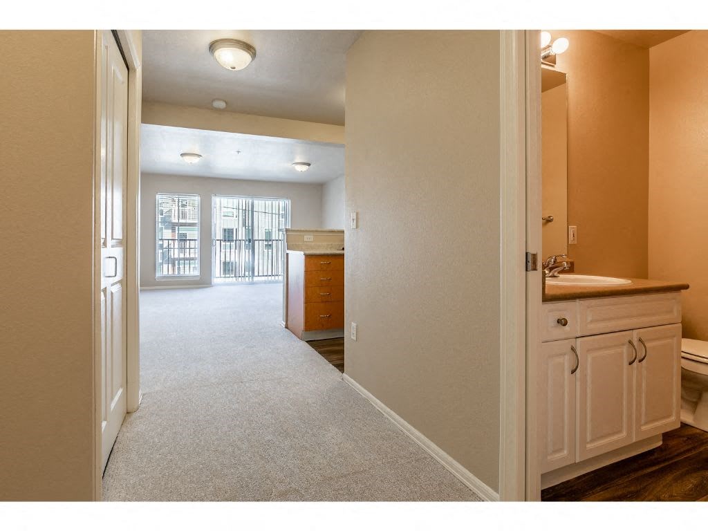 an open bathroom with a sink and a mirror