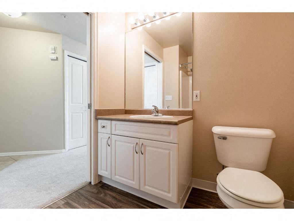 a large mirror in a bathroom with a wall quote on it