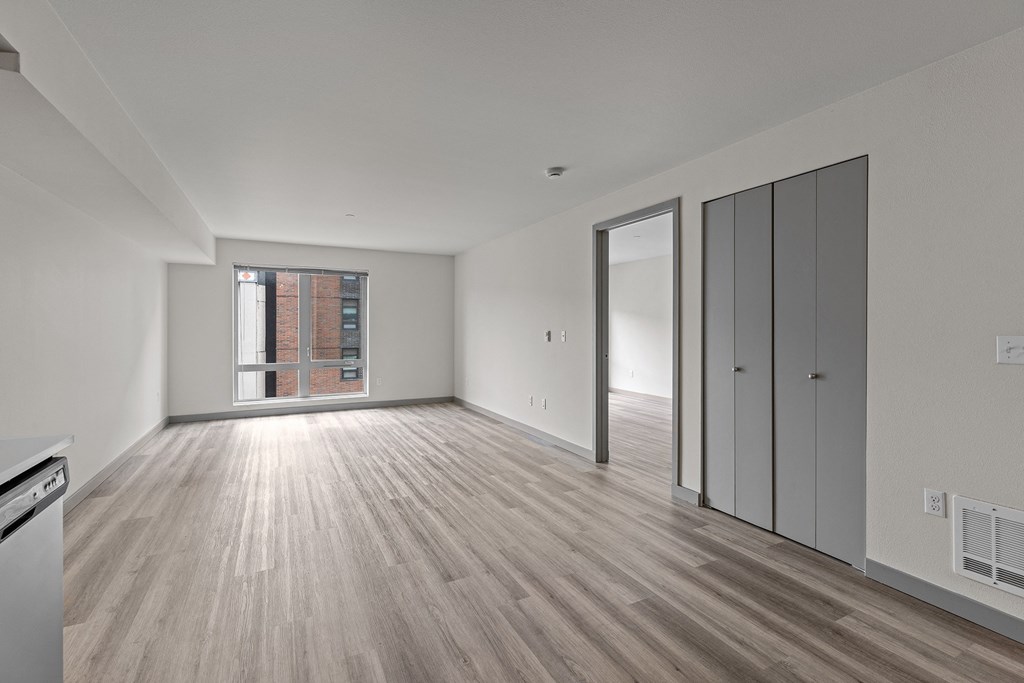 A room with wooden floors and white walls.