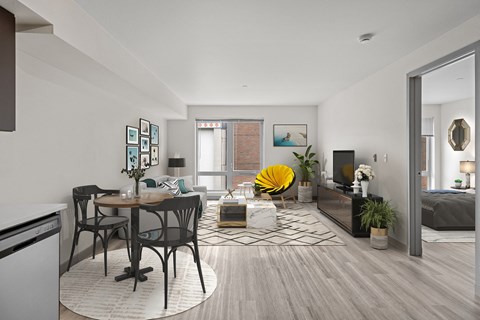 A modern living room with a dining table and chairs.