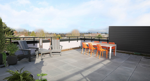 A patio with a table and chairs.