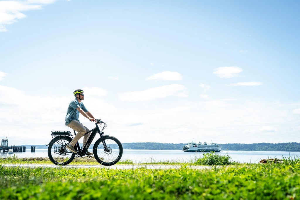 A person riding a bike on a sunny day.