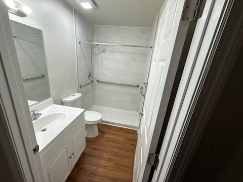 A white bathroom with a toilet, sink, and bathtub.