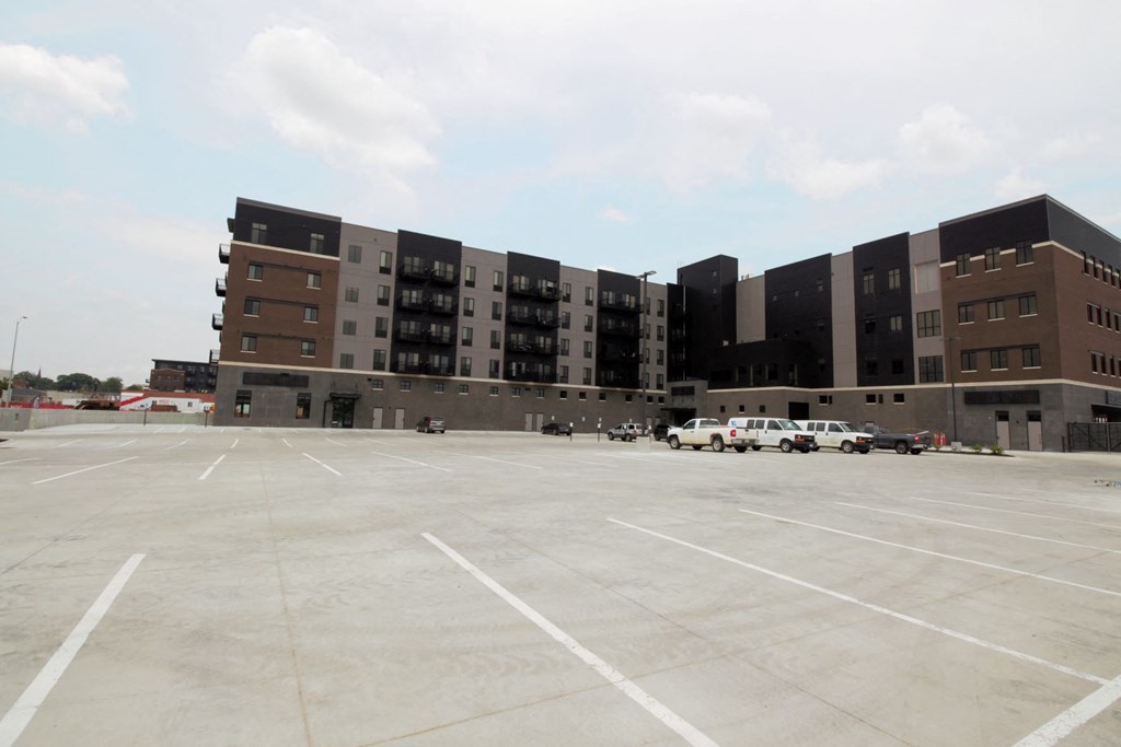 an empty parking lot in front of a building