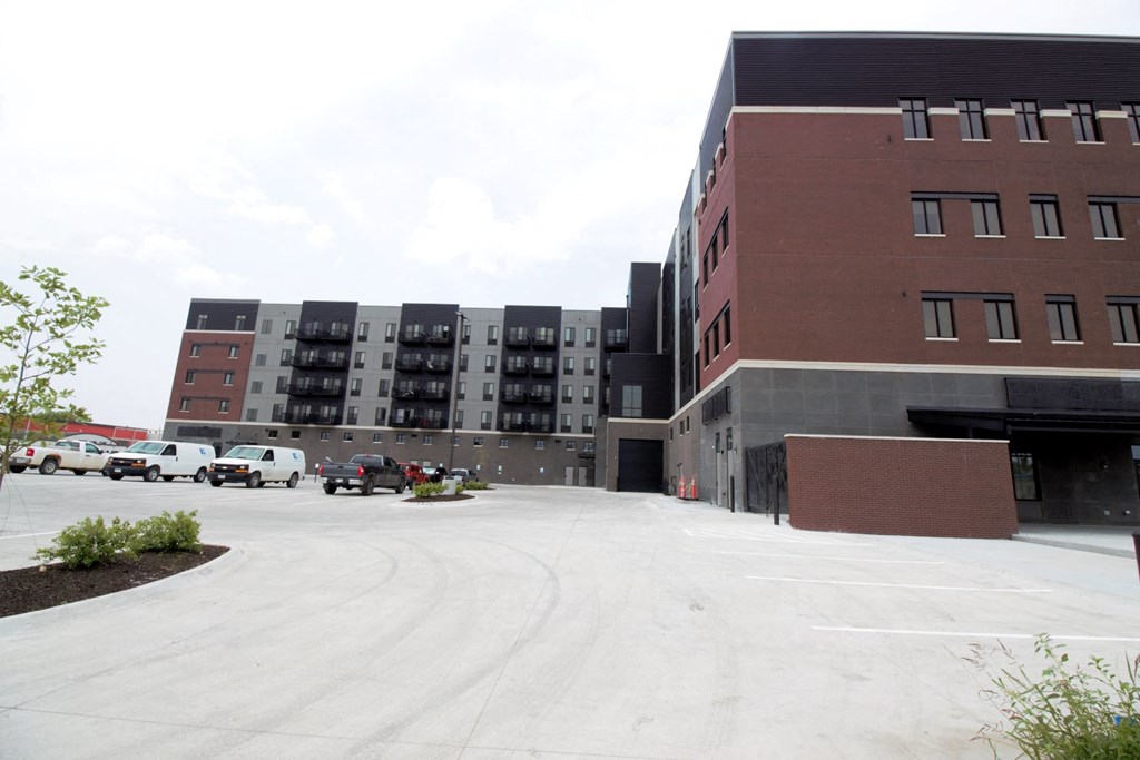 an empty parking lot in front of a building