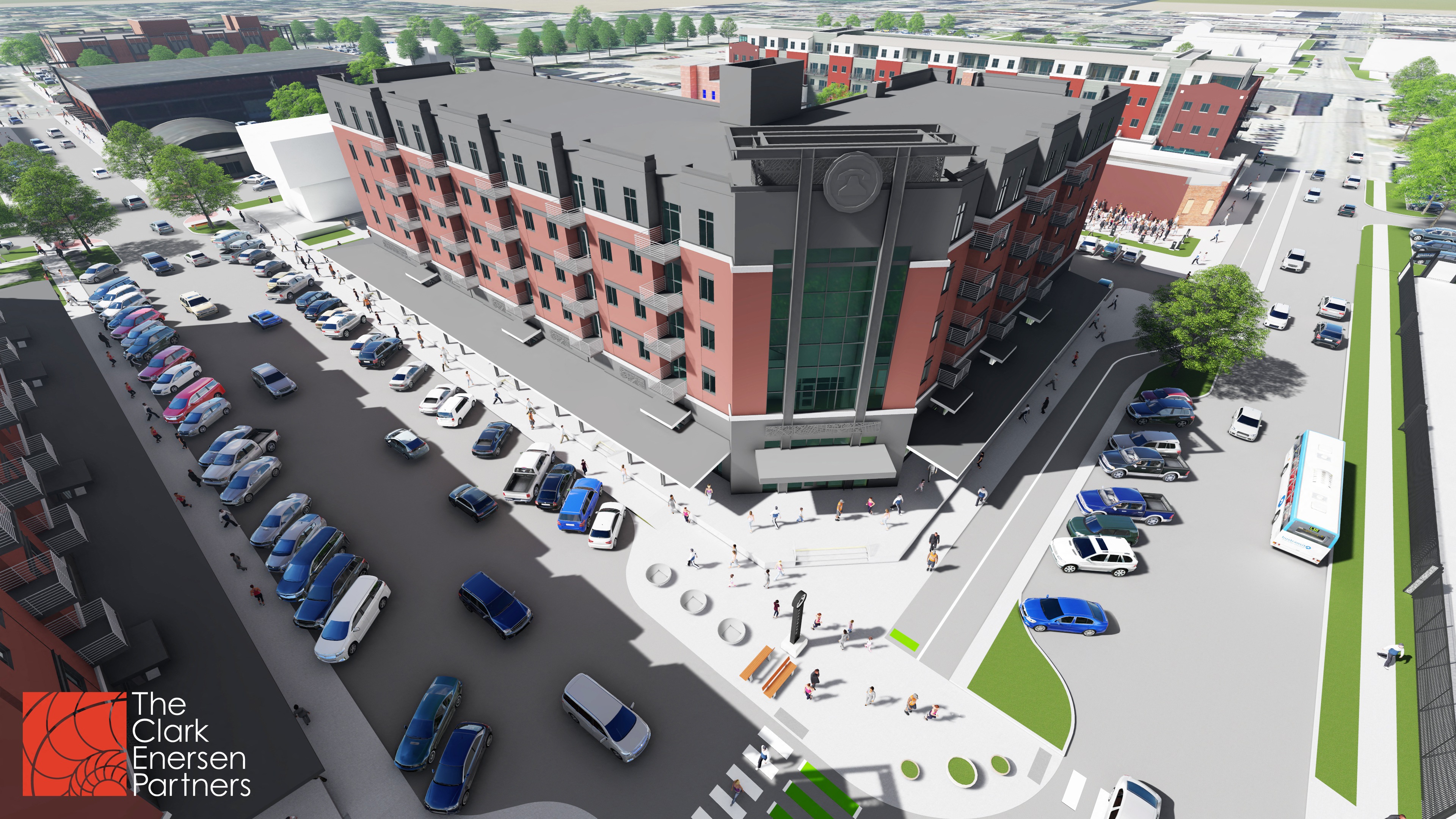 an aerial view of a parking lot with cars and a building