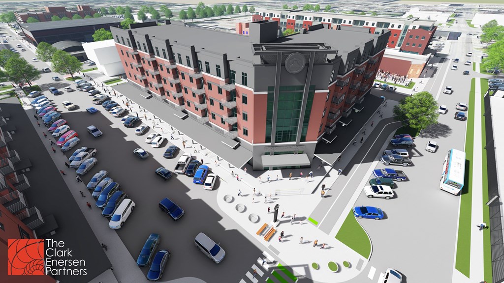 an aerial view of a parking lot with cars and a building