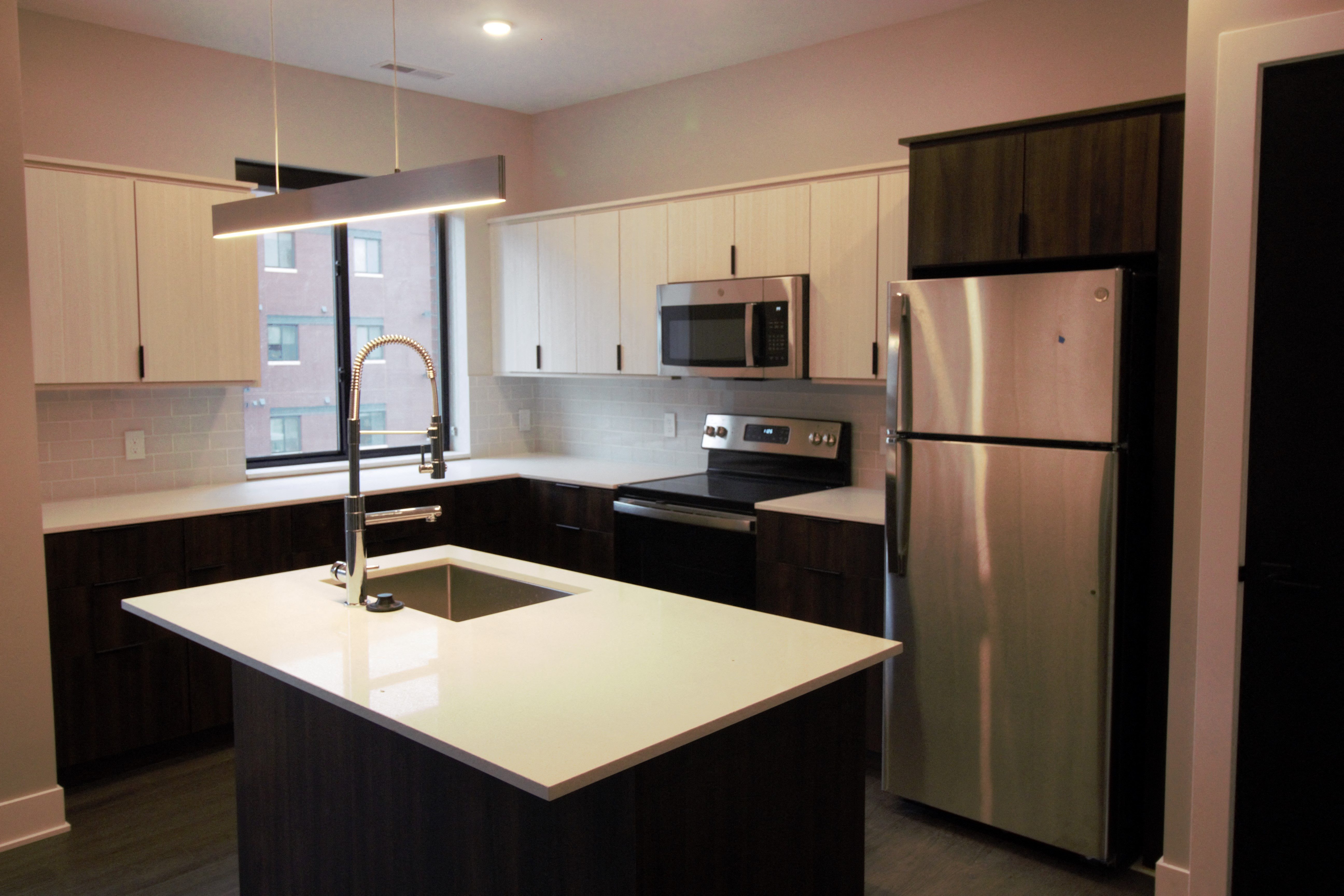 a kitchen with a sink and a refrigerator