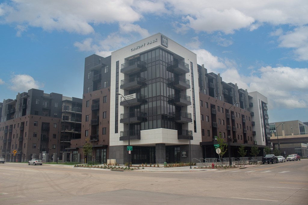 a large building with a parking lot in front of it