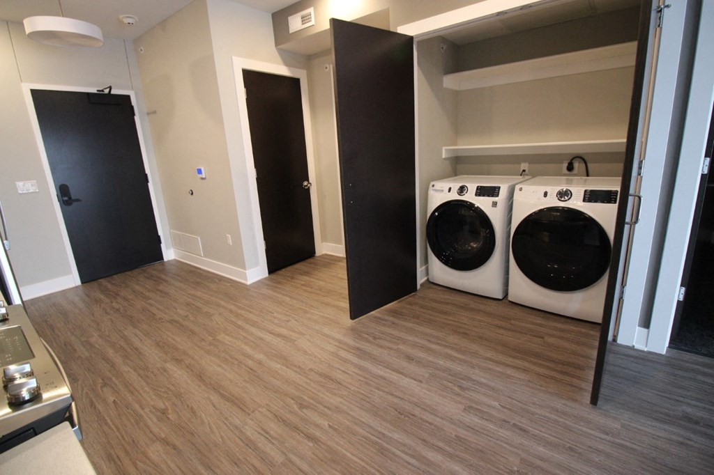 a laundry room with two washes and a dryer in it