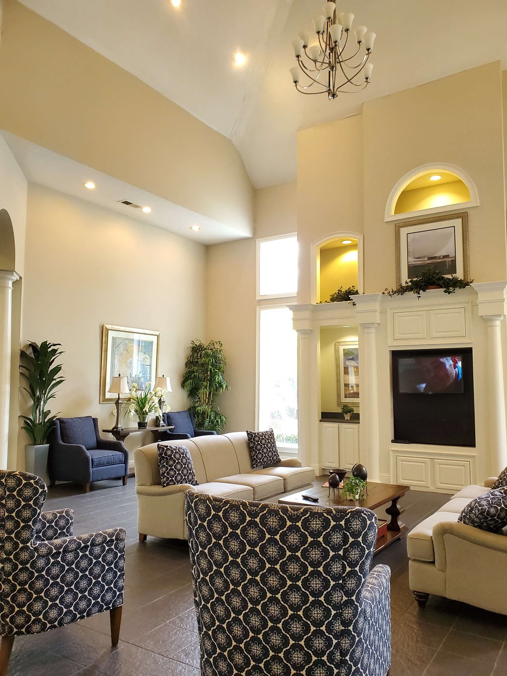 a living room filled with furniture and a large window