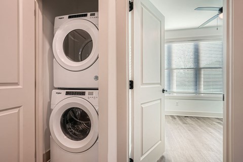 A white washer and dryer in a laundry room.